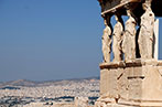 Statues at the Parthenon in Athens set against a view of the city