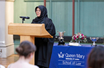 Student in a headscarf standing at a podium during the 2022 George Hinde Moot