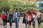 Queen Mary students walking through the mile end campus