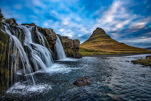 A waterfall in front of Kirkjufell mountain, Iceland