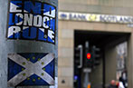 A lamp post with a sticker stating 'End London Rule' written against the Scottish flag, and another sticker below of the Scottish flag with the EU stars overlayed