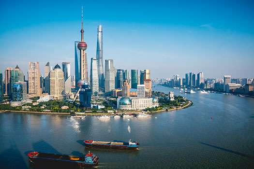 Shanghai skyline and against a sunny blue sky
