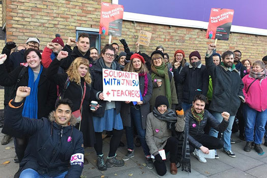 Academics on Mile End Road taking part in the strike
