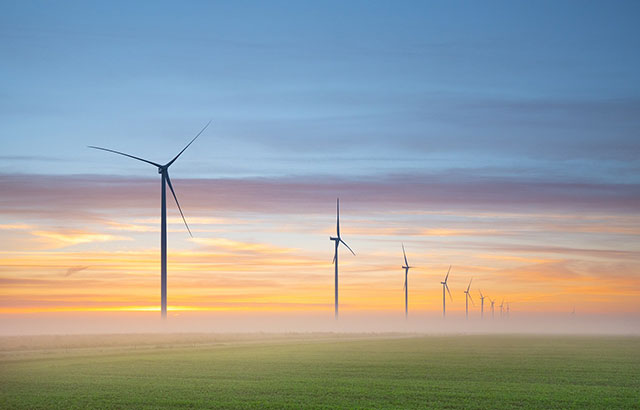 Wind turbines at dawn in the Netherlands.