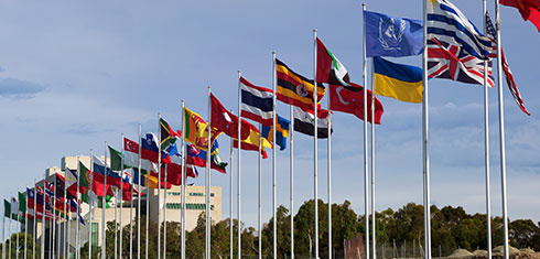 Flags of countries around the world blowing in the wind