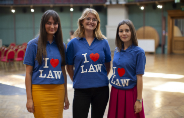 Three students, wearing T-shirts 'I love Law'