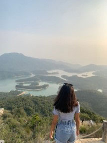 Tejal Shah at the top of a mountain looking over the Thousand Islands reservoir in Hong Kong
