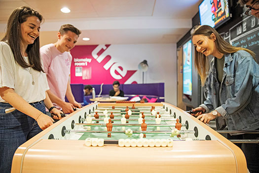 Students playing table football
