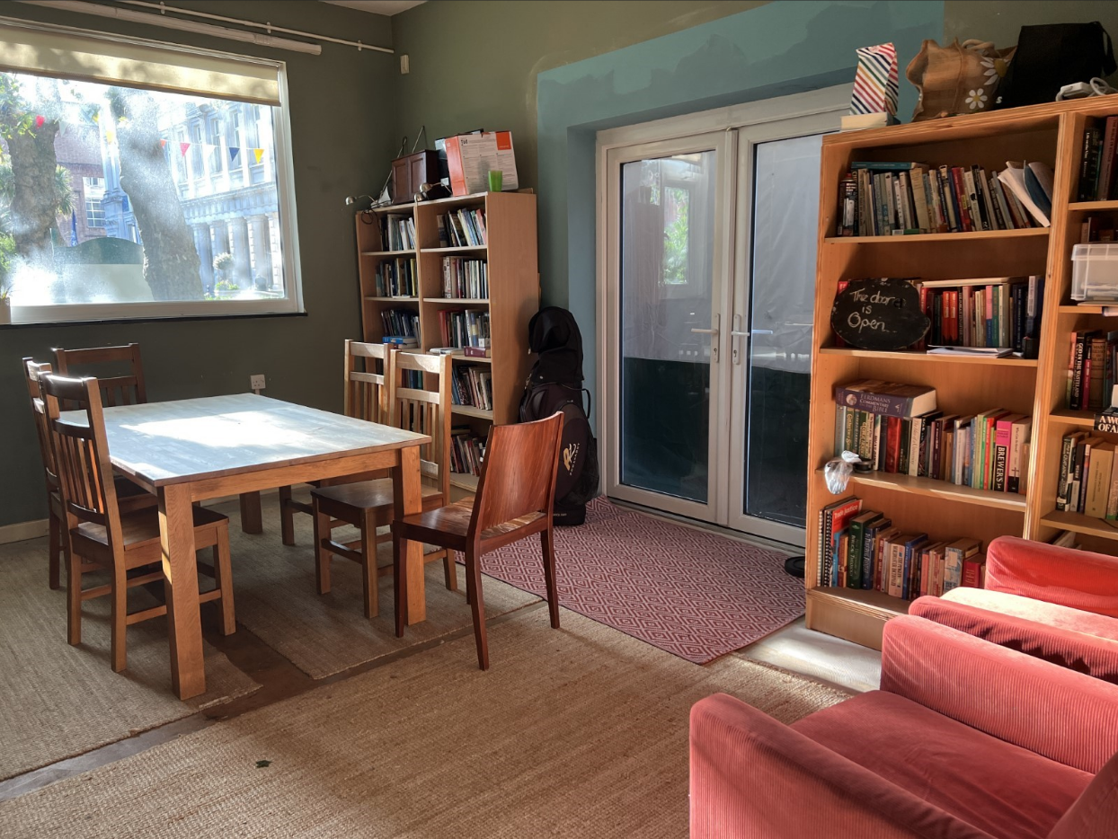 Indoors at the St. Benet's Chapel with bookshelves and sitting area
