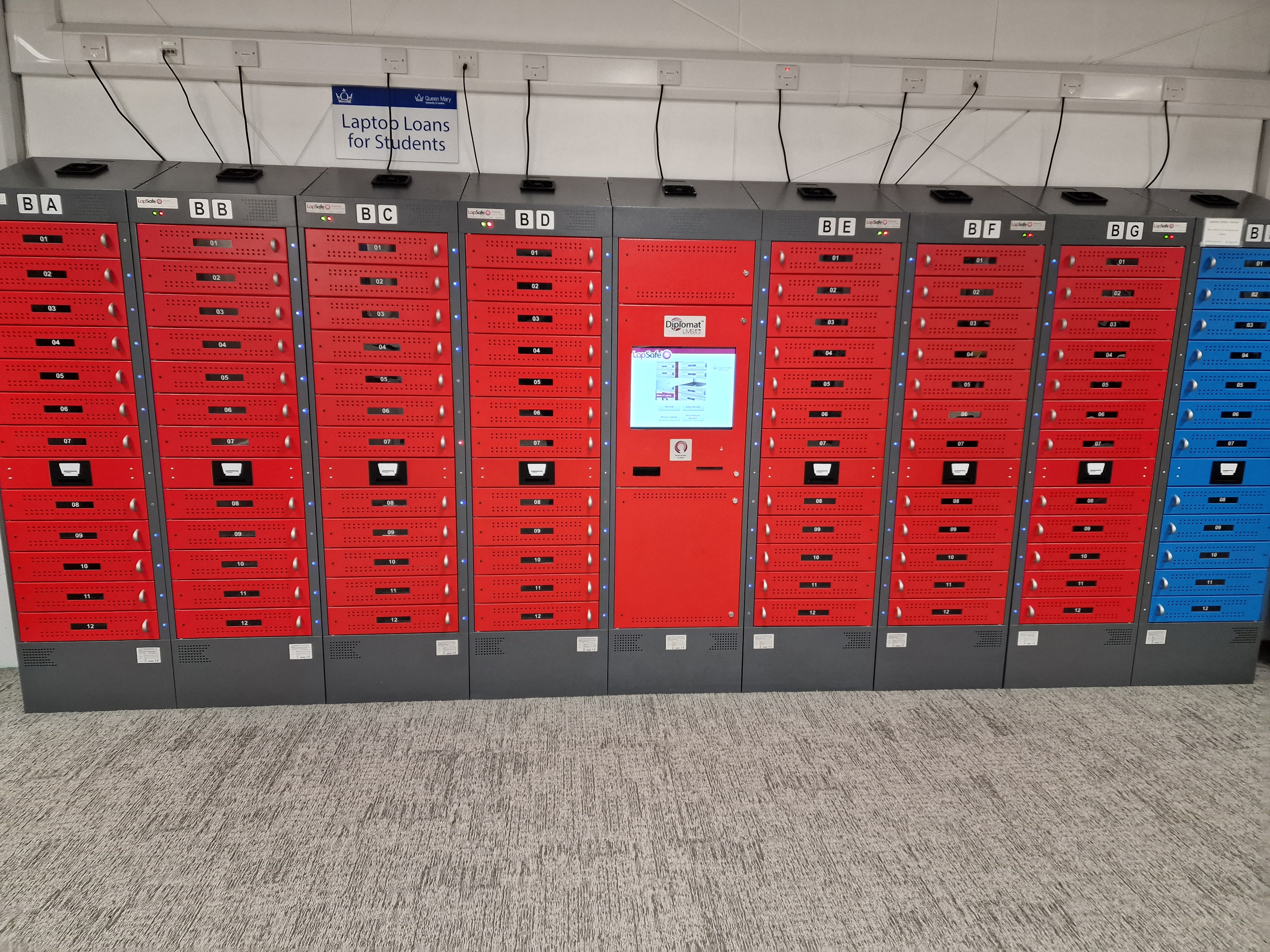 Red lockers holding laptops on the Mile End Library Ground Floor