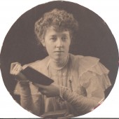 Portrait photograph of Katherine Lyttelton holding a book