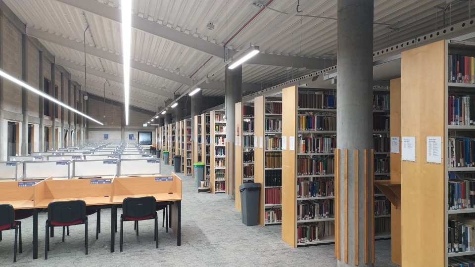Collection of bookshelves and independent study desks in newly renovated Second Floor Mile End Library