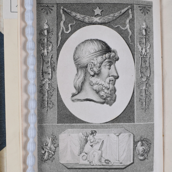 Book plate showing profile of Plato surrounded by decorative Grecian imagery.