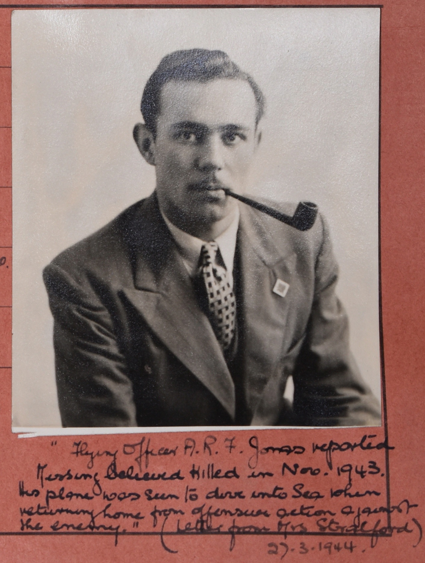 Photograph of Alfred Jonas smoking a pipe with notes regarding death handwritten underneath