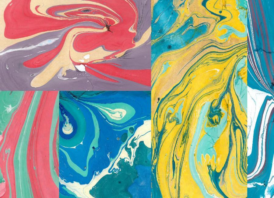 Pieces of paper with swirling marbled ink in shades of yellow, green, blue, pink red and purple