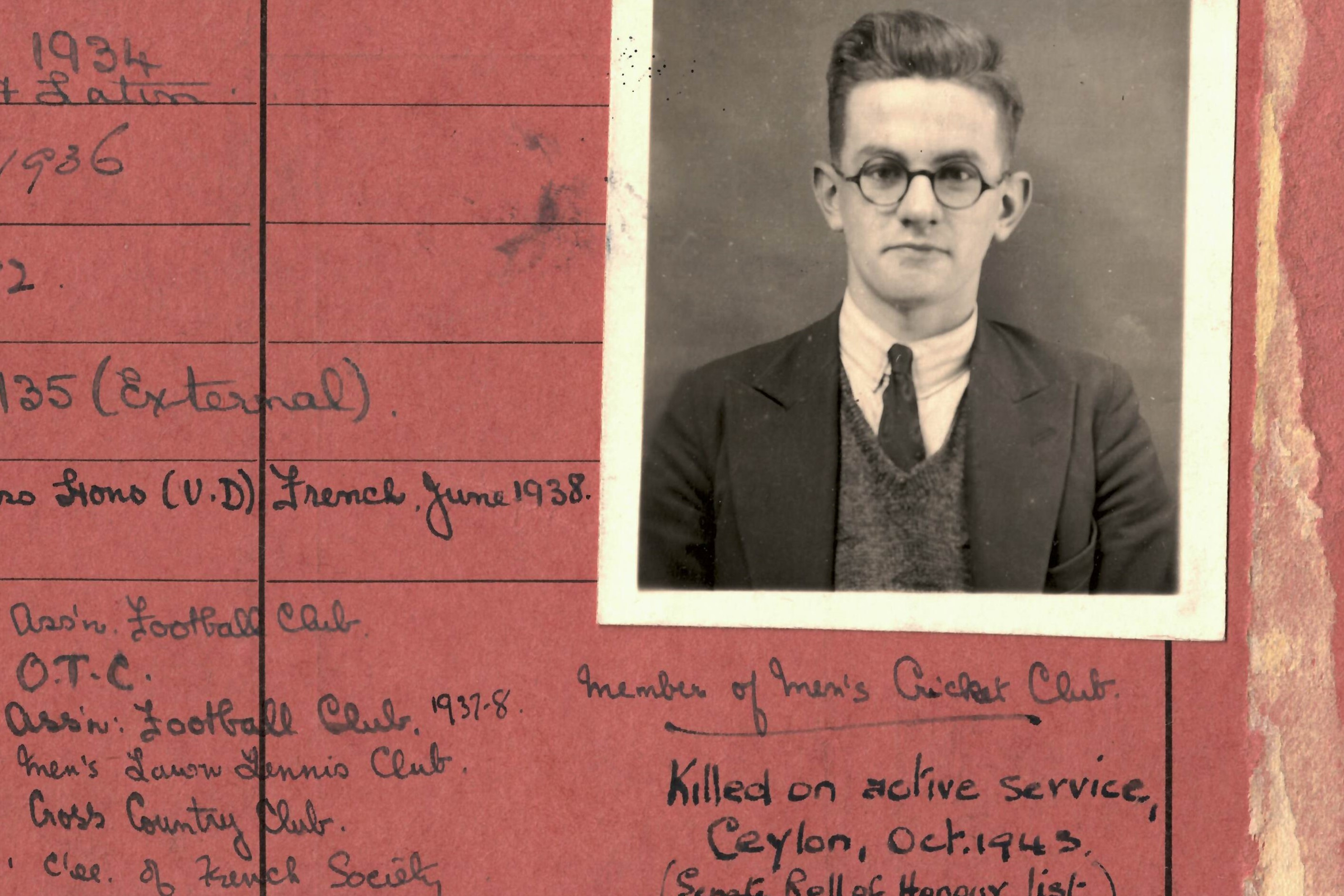 Student card, red, with handwritten text noting 