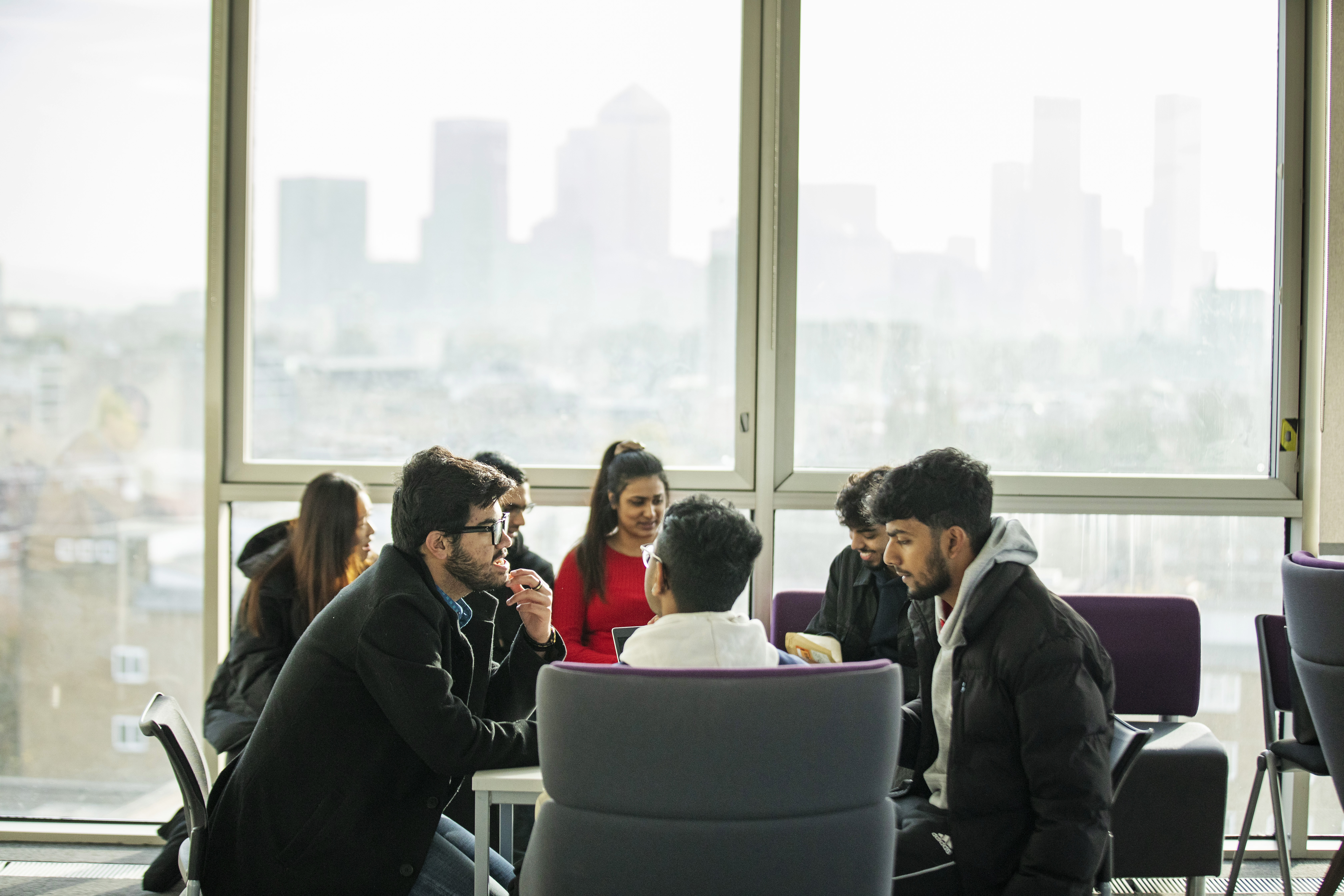 Group of students studying with London Skyline in the background