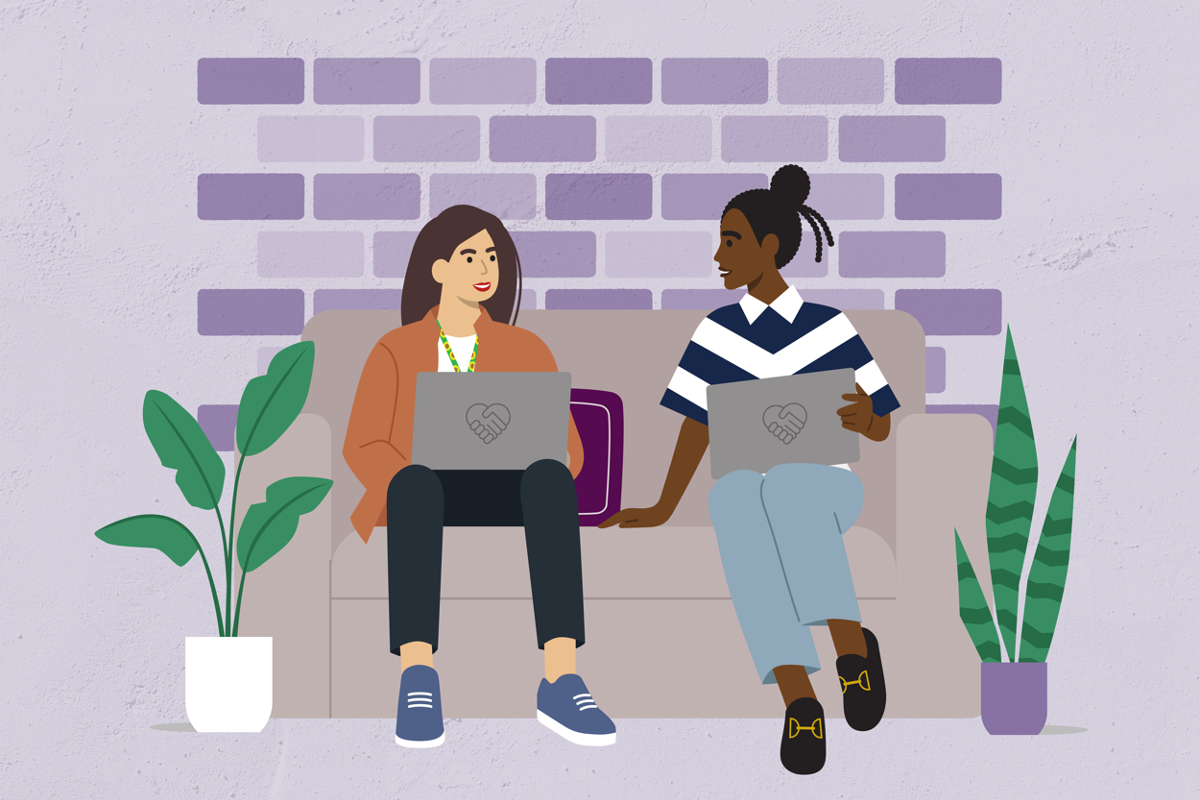 A picture of two women with laptops that have the Give to Gain symbol