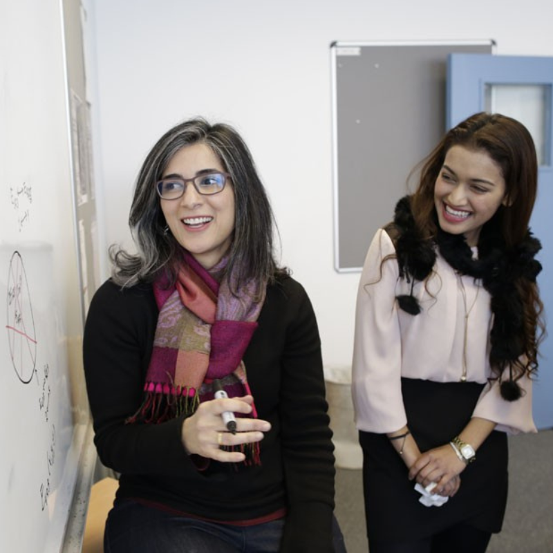An image of two students engaging in Girls in Maths Day
