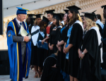 Professor Colin Bailey greeting students at the Queen Mary, Malta Graduation