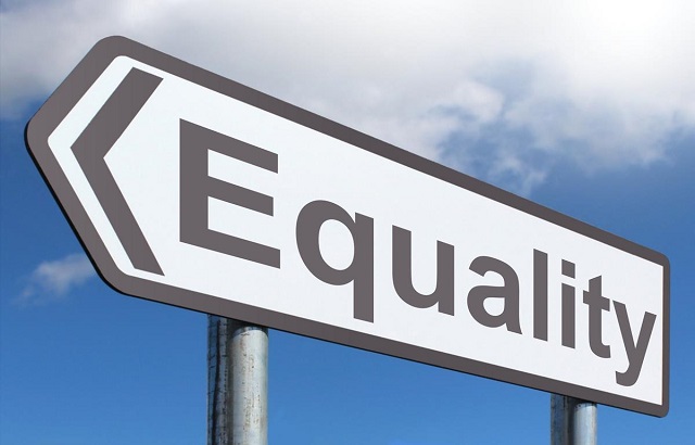 A road sign with the word 'equality' on it