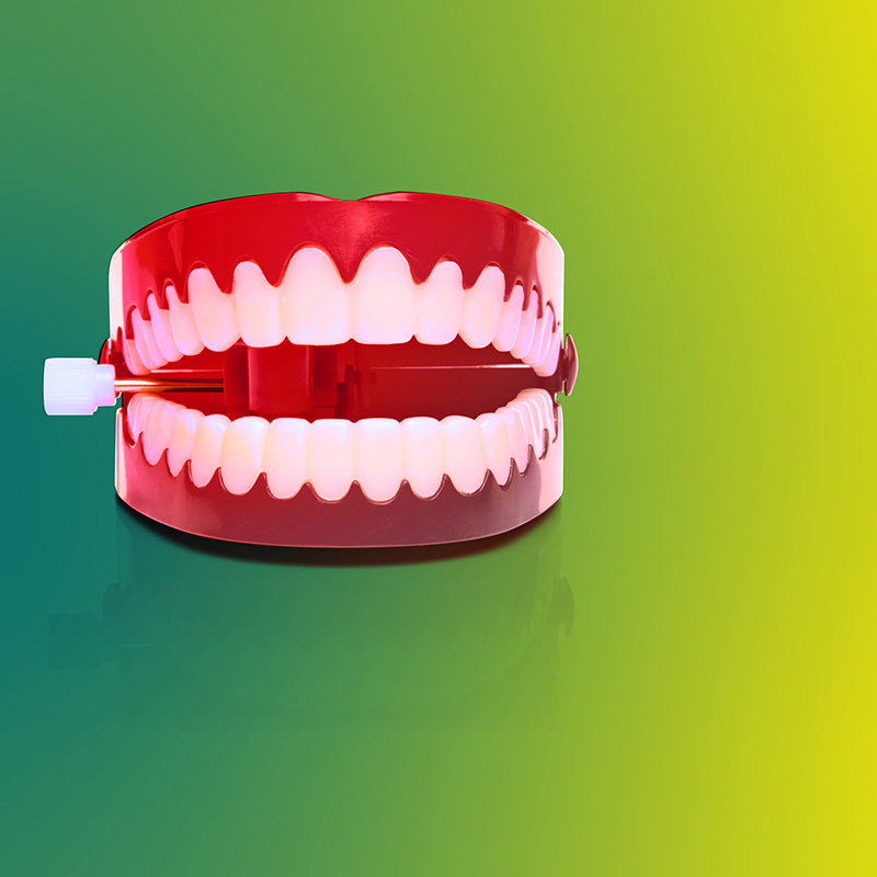 fake teeth with green background