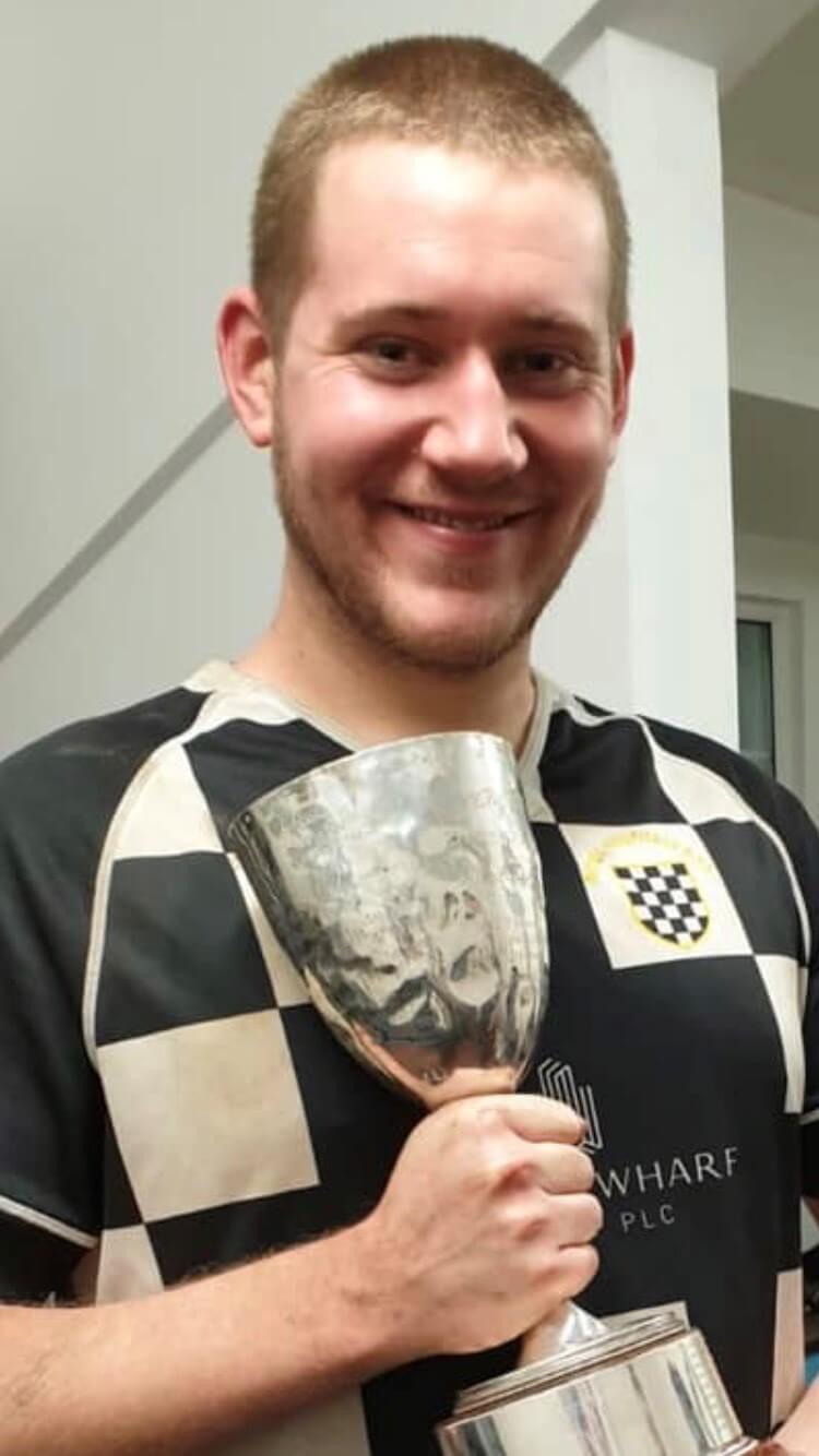 Dominic Morey holding the 2nd XV UH Cup