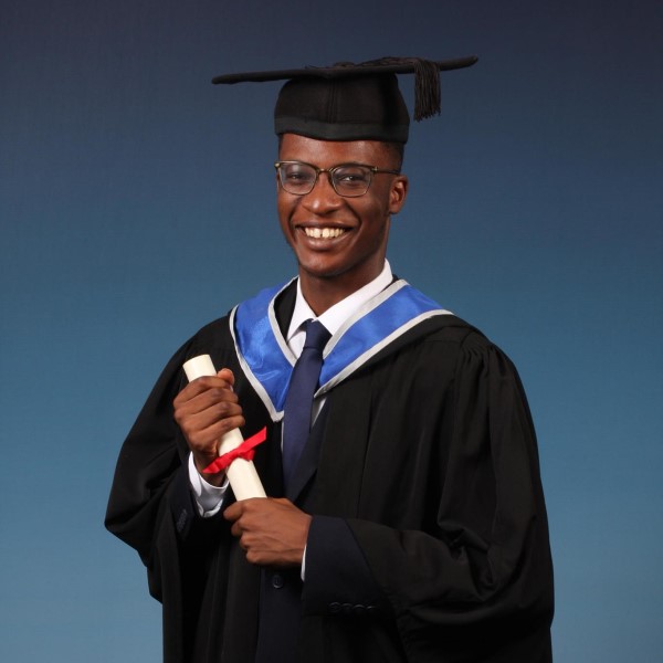 Headshot of alumnus, Tomiwa Owolade