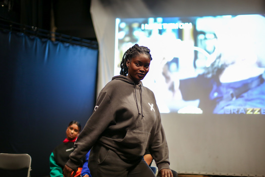 Female drama student performing onstage