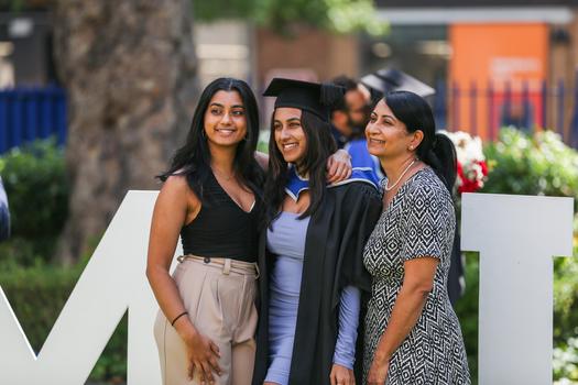 Student celebrating graduation with friends and family