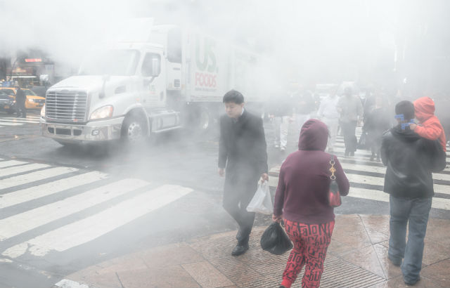 Photograph: A street in New York with heavy vapour from the underground