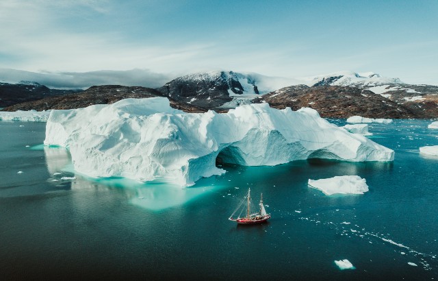 Photograph of a boat sailing through the Artic Ocean