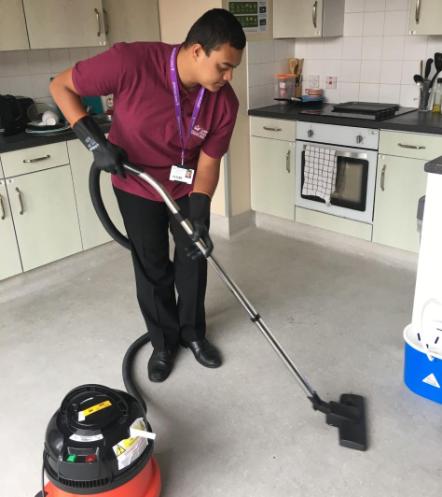 Intern Yusuf working with the residential cleaning team