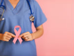 Doctor holding cancer ribbon 