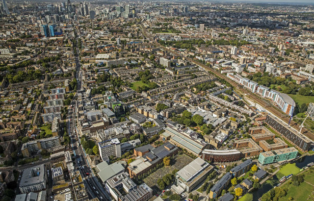 An aerial image of the Queen Mary campus and local community