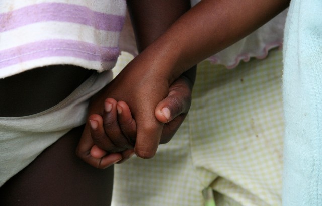 Image of African children holding hands. Credit: iStock.com/adl21