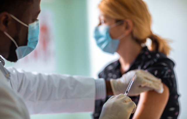 Image of woman being vaccinated. Credit: geber86/iStock.com