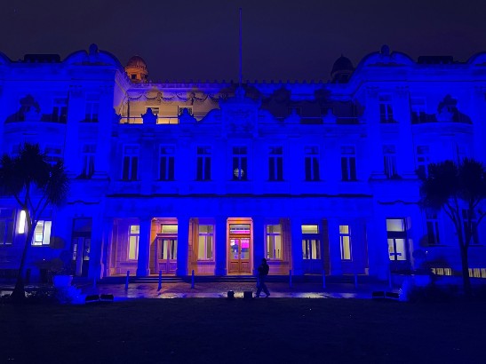 Queens’ Building lit up blue in honour of the NHS