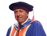 Picture of Peter in blue graduation gown and black felt graduation hat