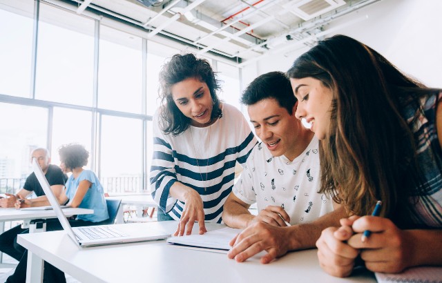 Image of students receiving guidance. Credit: iStock.com/CesarOkada