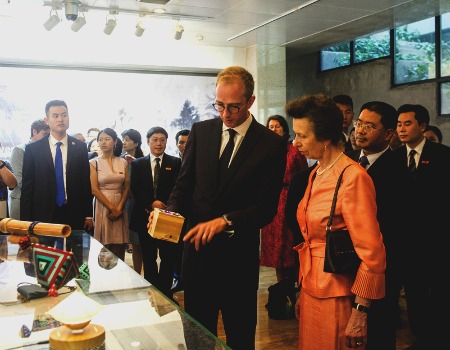 Dr Nick Bryan-Kinns showing HRH The Princess Royal interactive music boxes inspired by the Dong culture