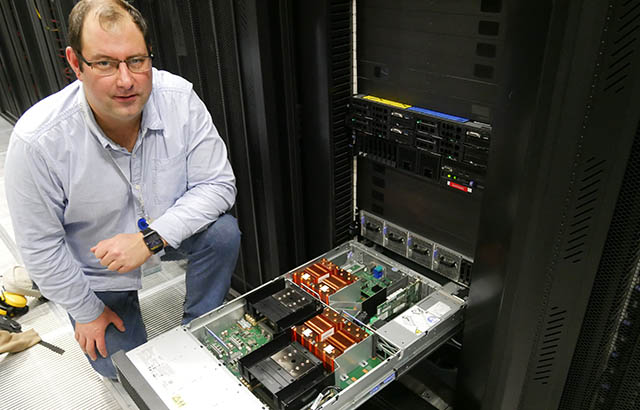 Dr Christopher Walker of the ITS Research Infrastructure team with the new computers