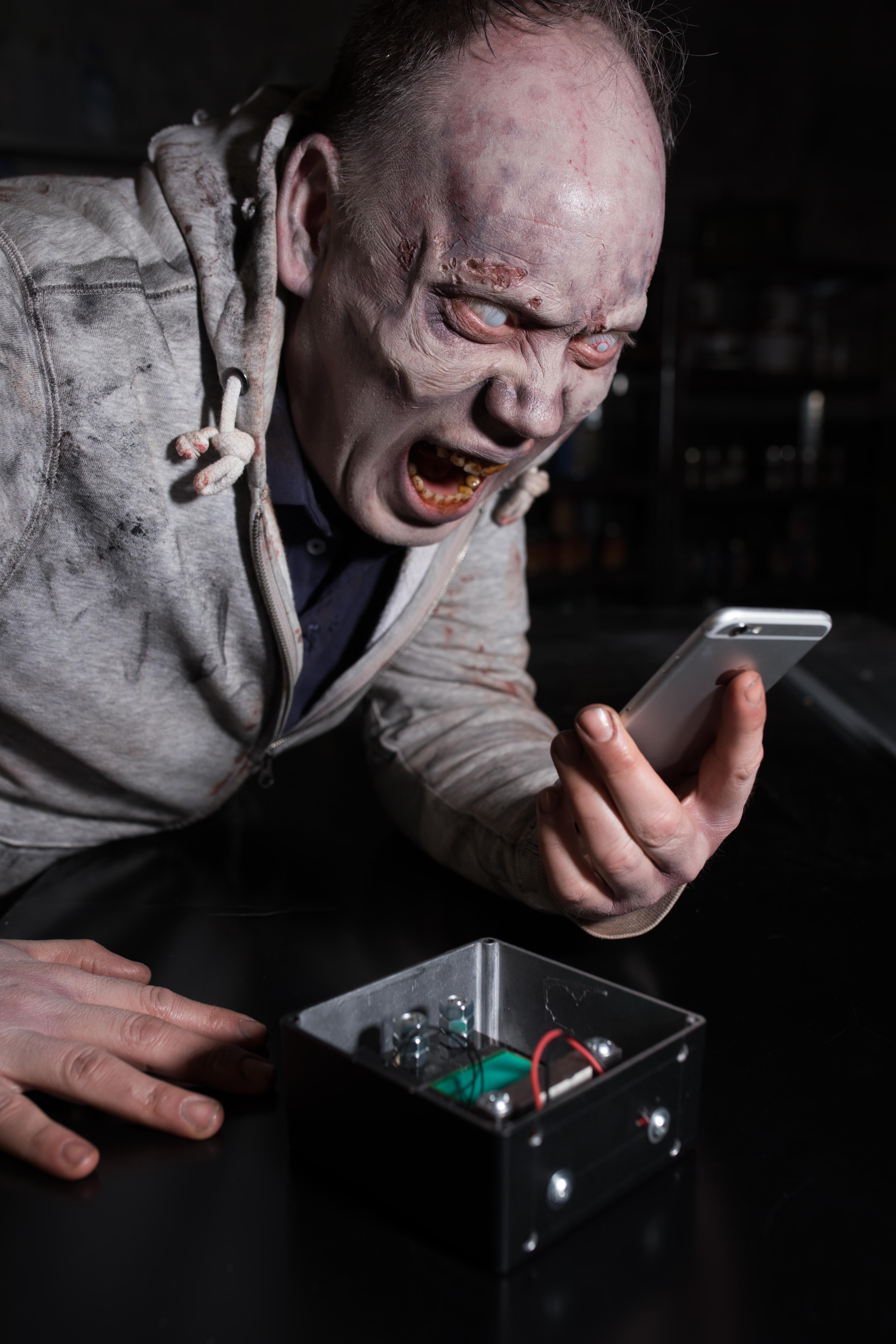 A zombie charging his phone using the energy harvesting technology. David Parry/PA Wire