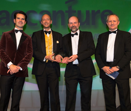 Ben Burns and Prof Jonathan Pitts (centre left and right) from Actual Experience accepting the award for Innovation and Entrepreneurship at the UK IT Industry Awards.