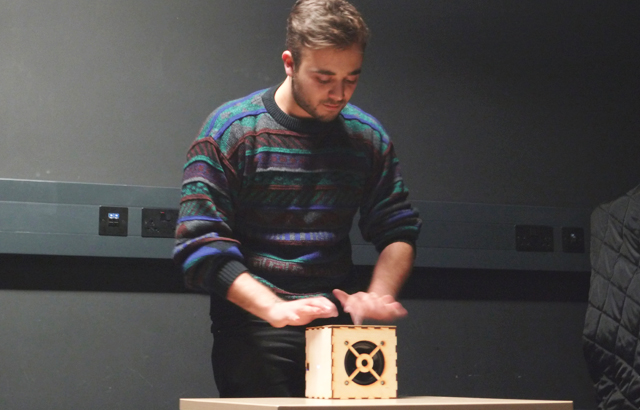 Classical guitarist Michael Poll tries out the experimental digital music cube 