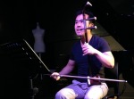 Researcher Luwei Yang playing the erhu