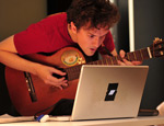 Dan Stowell tries out HOTTTABS at the Music Hack Day (Image courtesy of Thomas Bonte)