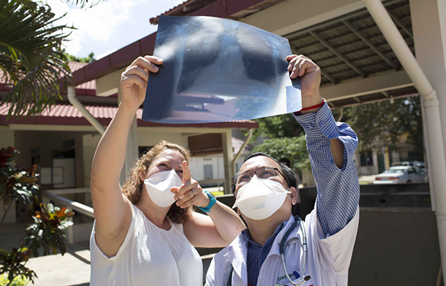 Jess and Dr Chhim examine a TB patient's X-ray at Kampong Cham hospital, Cambodia. Credit: Tom Maguire/RESULTS UK