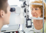 Elderly woman receiving eye exam
