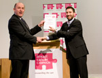 Claudio Raimondi receiving the award from Breast Cancer Campaign